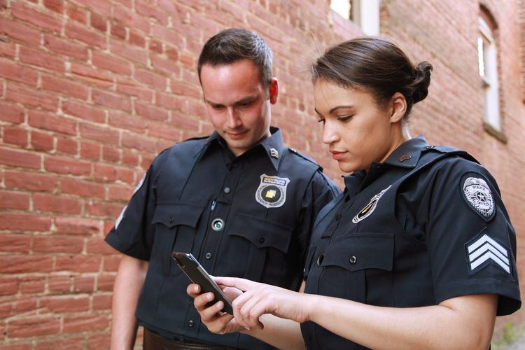 Image of two security guards discussing, Blog, Metro Surveillance Security